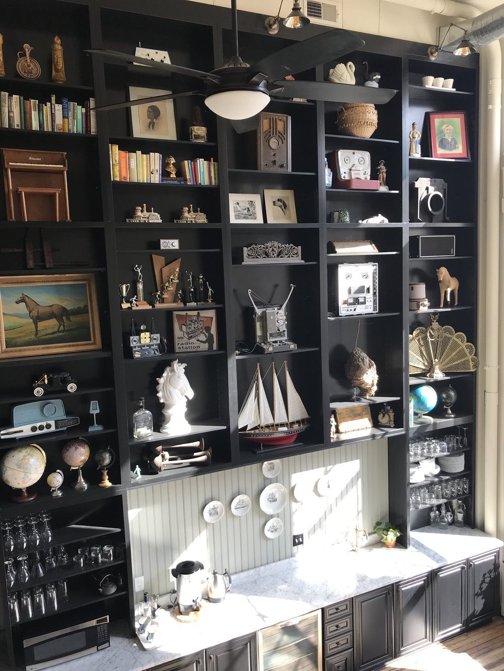 Books, art, and collected objects at Black Iris